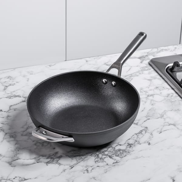 Cast iron wok with lid deals